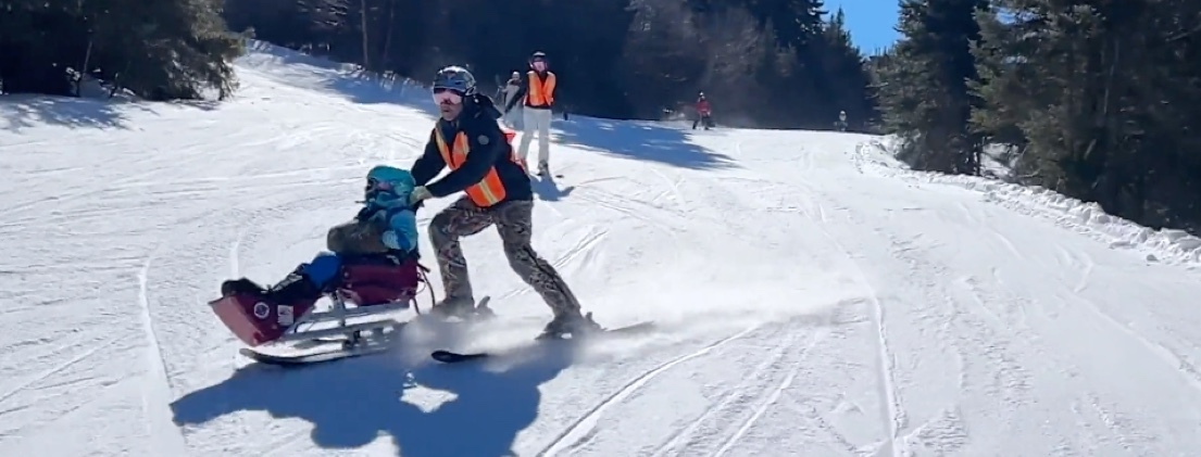 Ruby and her dad skiing